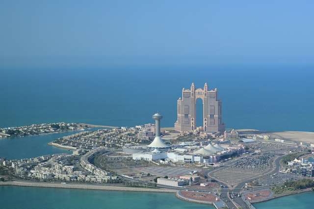 Abu Dhabi Corniche and Marina Mall seen from a helicopter