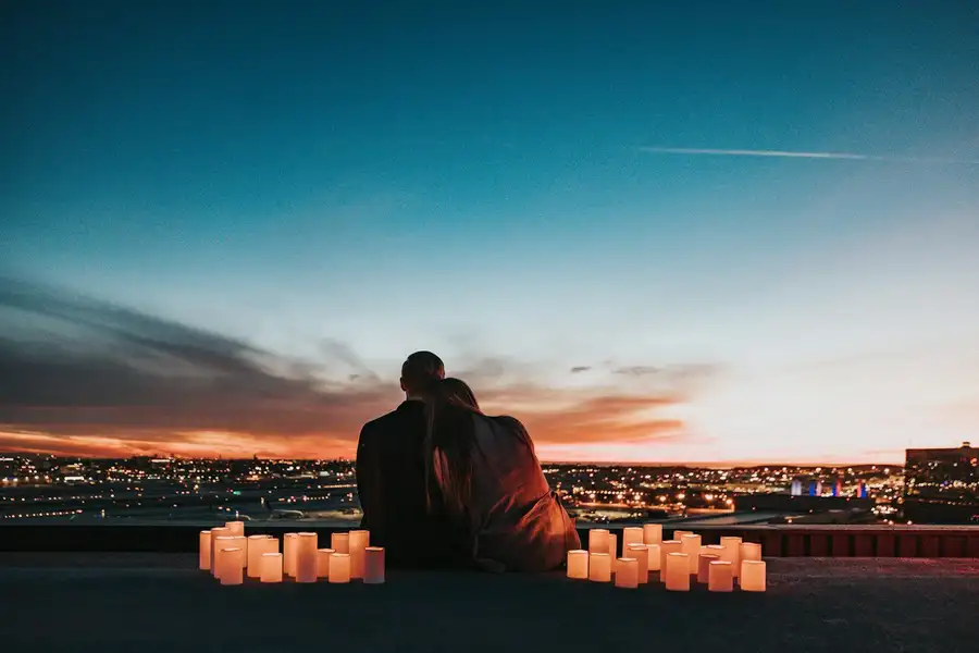 Candles set out for a proposal at sunset